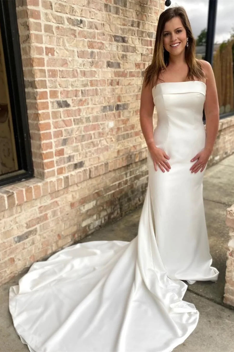 Vestido de novia sirena con espalda sin tirantes y lazo